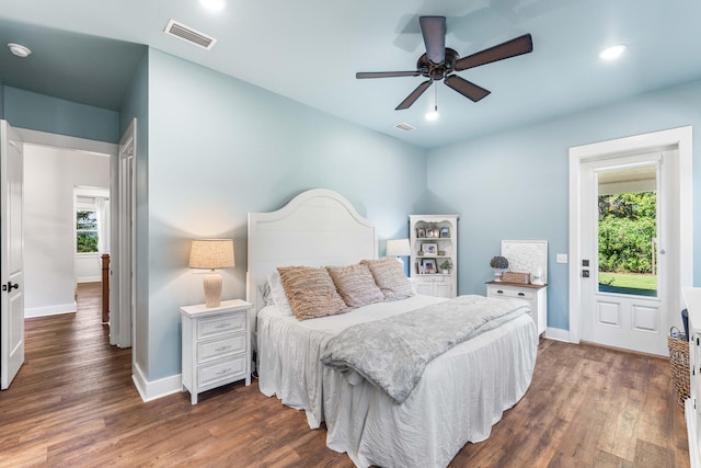 bedroom with ceiling fan and dark hardwood / wood-style floors