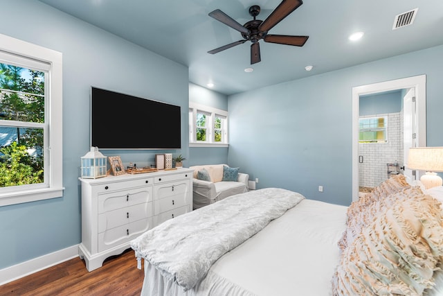 bedroom with dark hardwood / wood-style flooring and ceiling fan