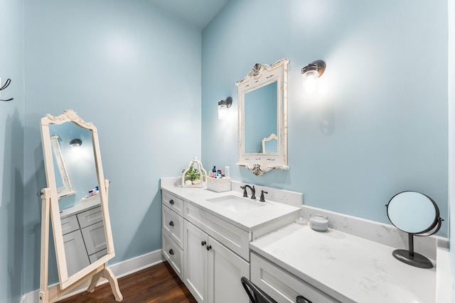 bathroom featuring vanity and hardwood / wood-style flooring