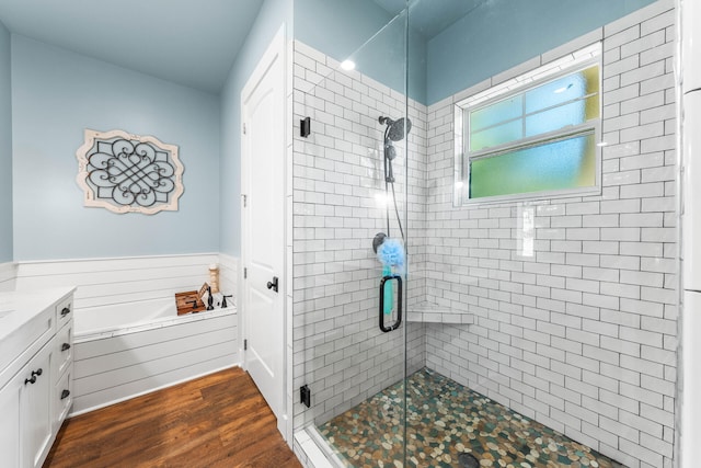 bathroom featuring vanity, wood-type flooring, and independent shower and bath