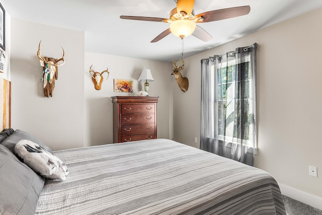 bedroom featuring ceiling fan and carpet flooring