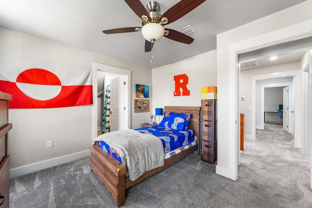 bedroom featuring dark carpet and ceiling fan