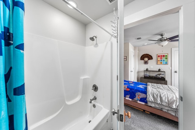 bathroom with shower / bath combo and ceiling fan