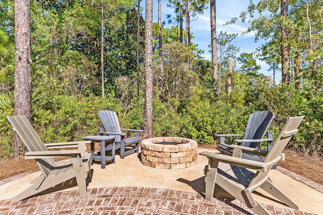 view of patio / terrace featuring an outdoor fire pit