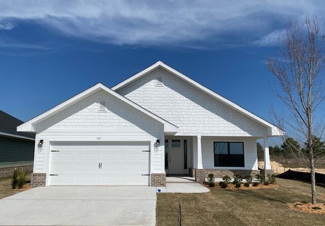 craftsman-style house featuring a porch and a garage