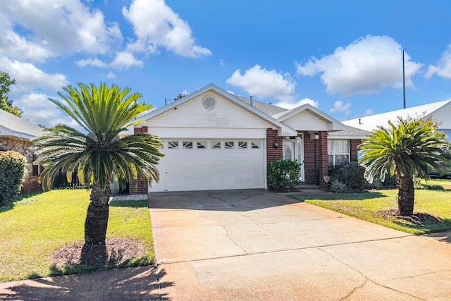 ranch-style house featuring a front yard and a garage