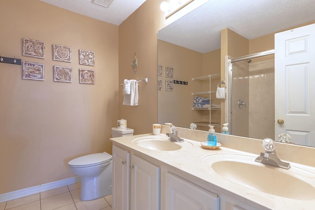 bathroom with a textured ceiling, toilet, vanity, an enclosed shower, and tile patterned floors