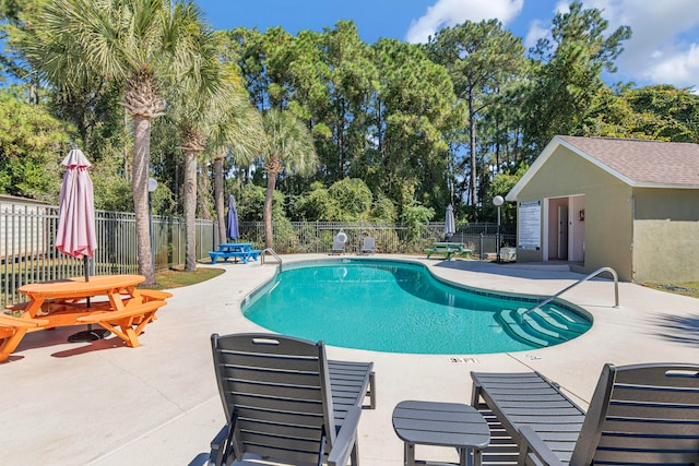 view of swimming pool featuring a patio area