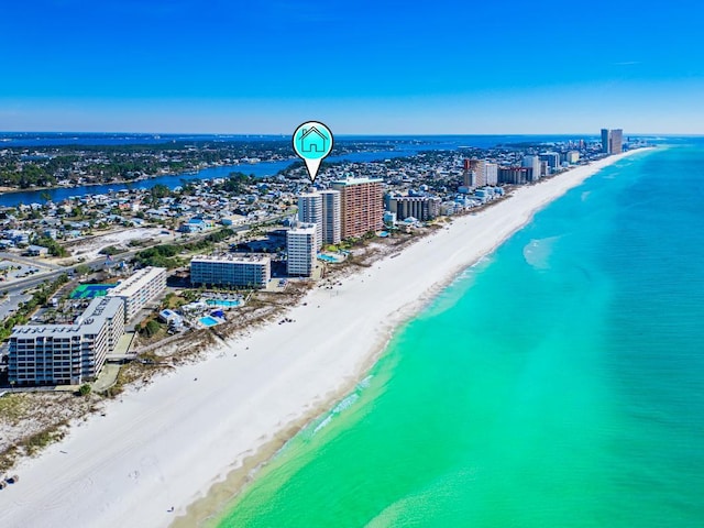 birds eye view of property with a view of the beach and a water view