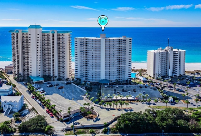 bird's eye view featuring a beach view and a water view