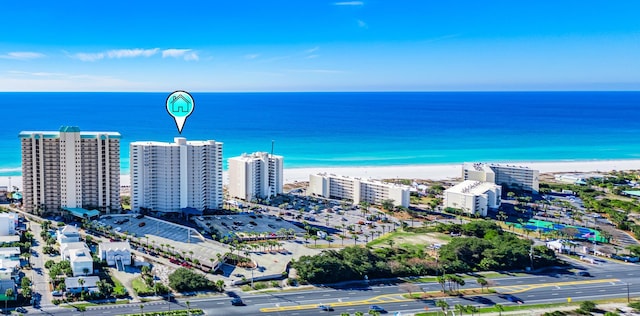 bird's eye view featuring a beach view and a water view