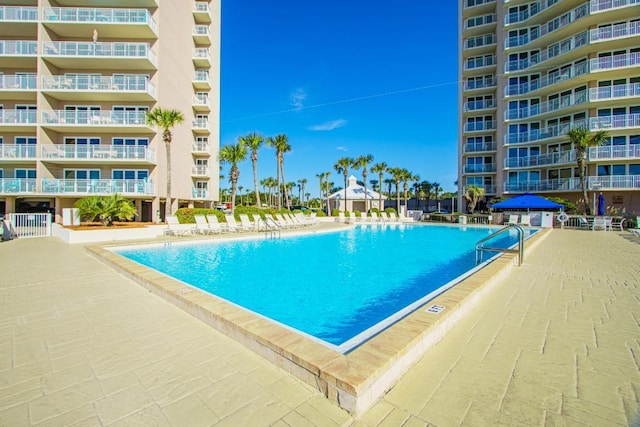 view of pool featuring a patio