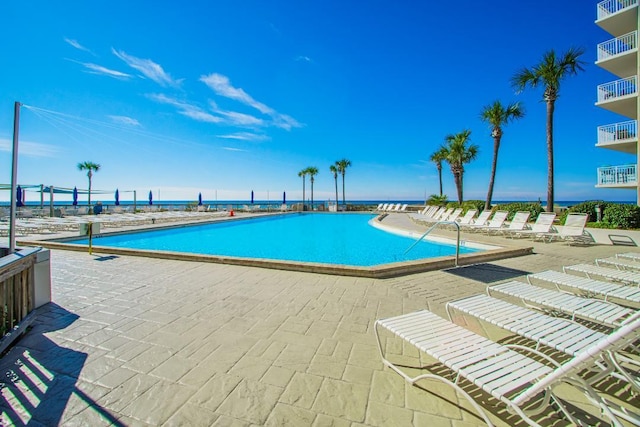 view of swimming pool with a patio area