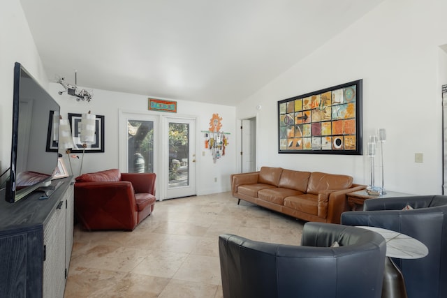 living room featuring vaulted ceiling