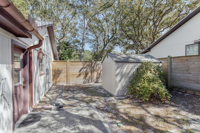 view of patio featuring a storage shed