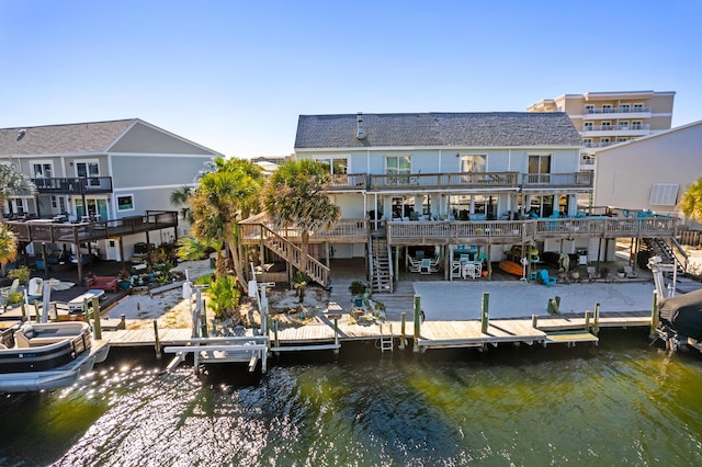 173 Durango Rd, Destin, FL 32541 - back of property with stairway and a deck with water view