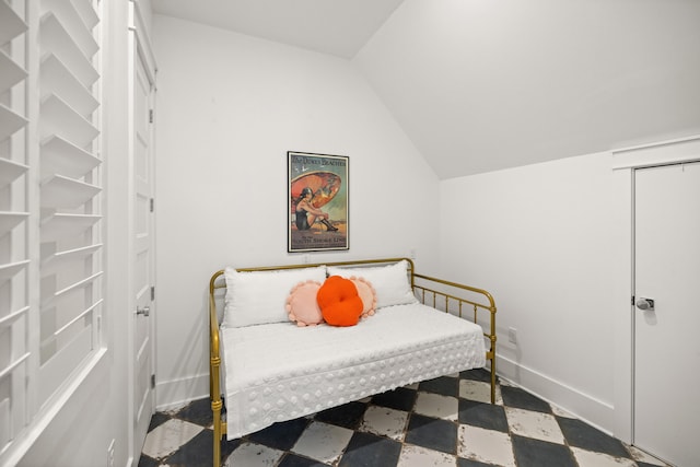 bedroom with lofted ceiling