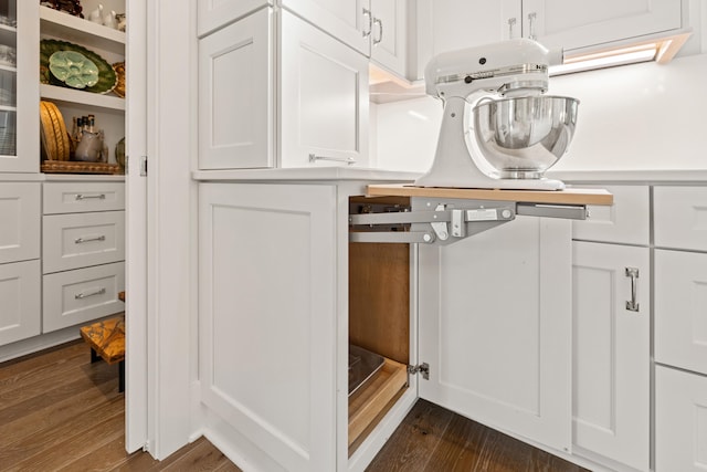 kitchen featuring dark hardwood / wood-style floors and white cabinetry