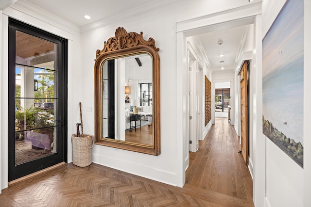 hall featuring dark parquet flooring and ornamental molding