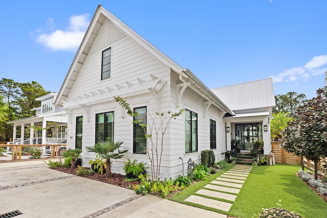 view of front of home with a front lawn and a porch