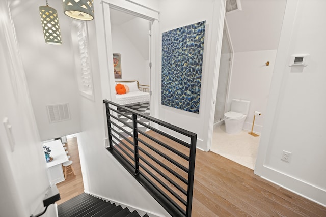 staircase featuring hardwood / wood-style flooring