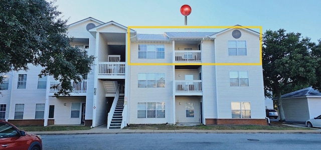 view of property featuring stairs