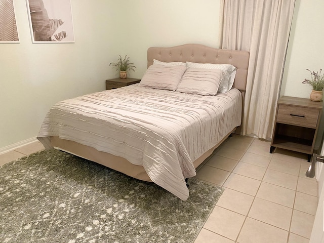 bedroom featuring light tile patterned flooring