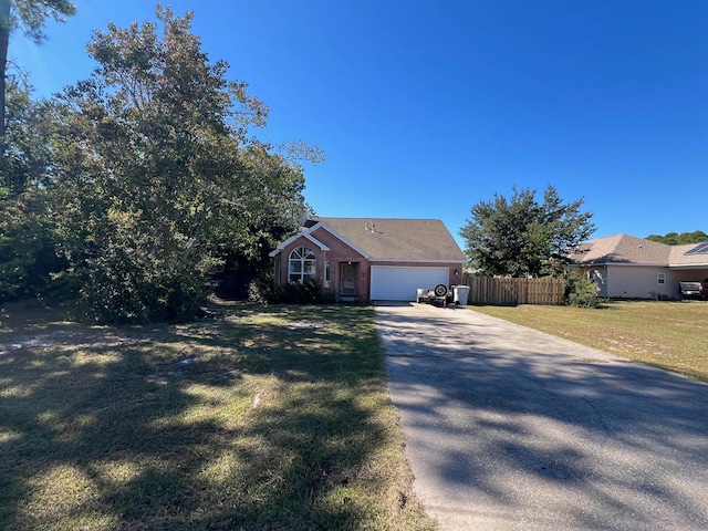 single story home with a garage and a front lawn