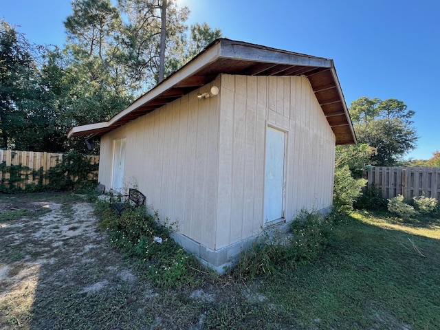 view of outdoor structure featuring fence