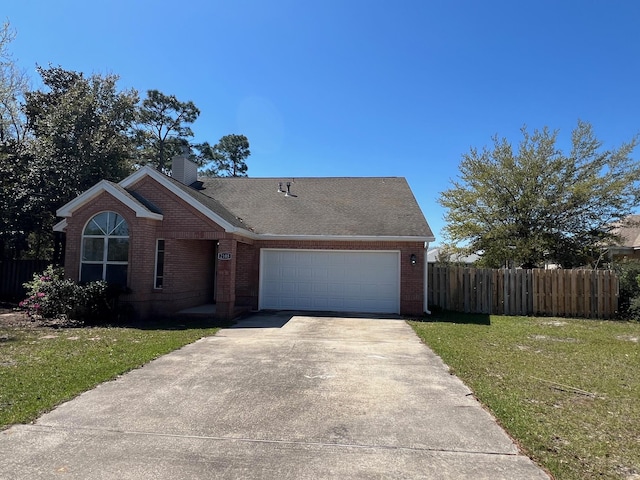 ranch-style house featuring fence, driveway, a front lawn, and brick siding