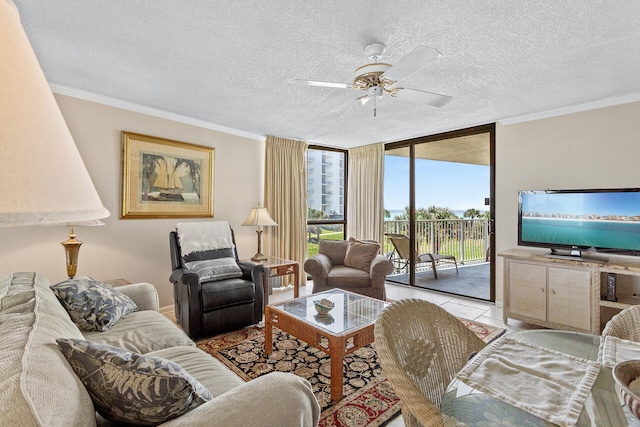 living room with crown molding, ceiling fan, a textured ceiling, and floor to ceiling windows