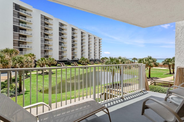 balcony featuring a water view