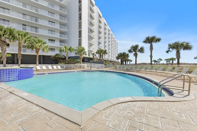 view of swimming pool featuring pool water feature