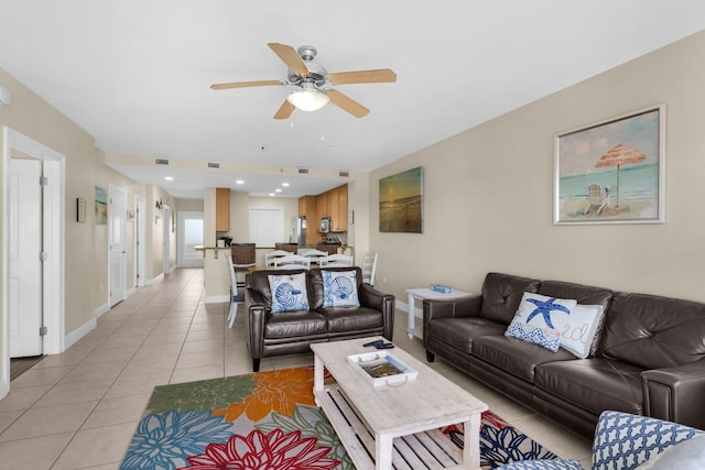 living room featuring ceiling fan and light tile patterned floors