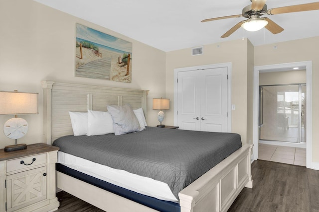 bedroom with a closet, ceiling fan, and dark hardwood / wood-style flooring