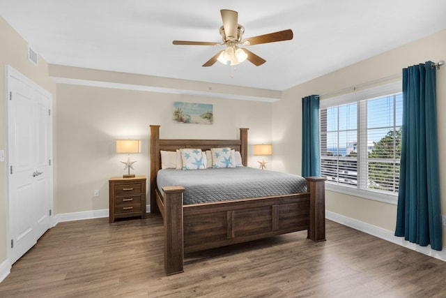 bedroom featuring wood-type flooring and ceiling fan