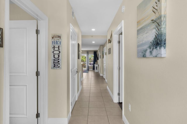 hallway featuring light tile patterned floors