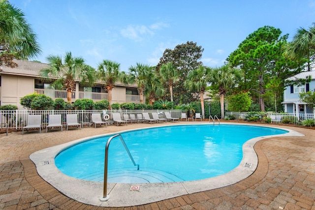 view of swimming pool featuring a patio area