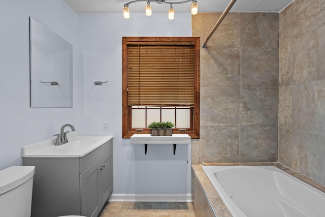 bathroom with toilet, shower / bath combination, a textured ceiling, and vanity