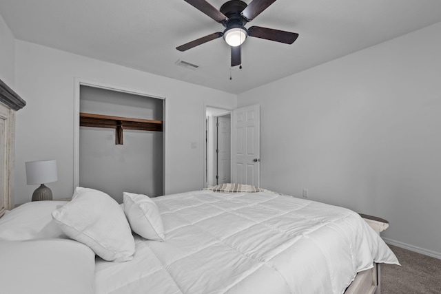 bedroom featuring baseboards, visible vents, ceiling fan, carpet, and a closet