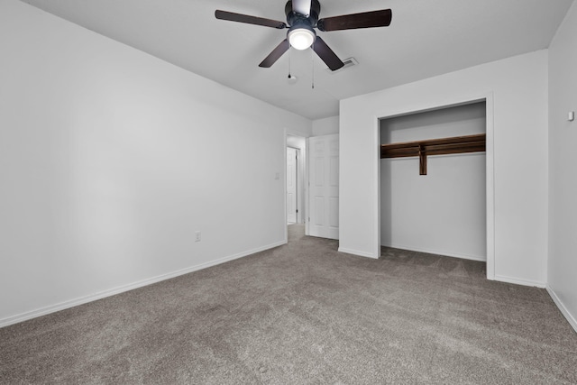 unfurnished bedroom featuring visible vents, baseboards, a ceiling fan, carpet floors, and a closet