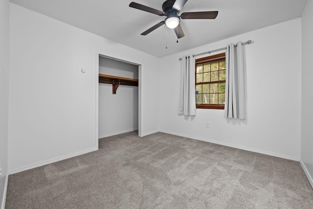 unfurnished bedroom with a ceiling fan, baseboards, a closet, and light colored carpet