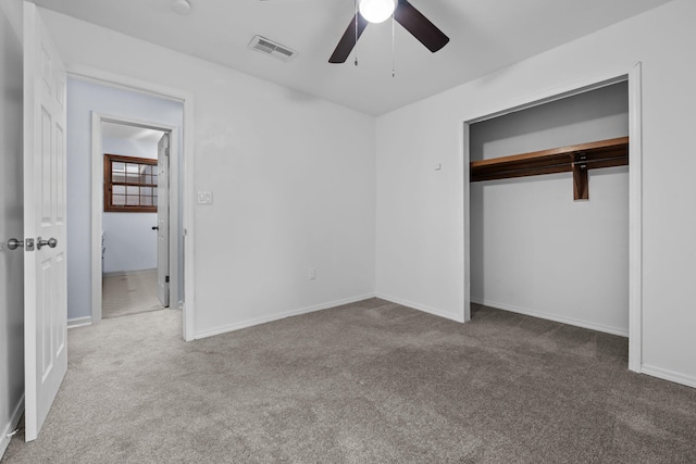 unfurnished bedroom featuring carpet, visible vents, ceiling fan, and baseboards