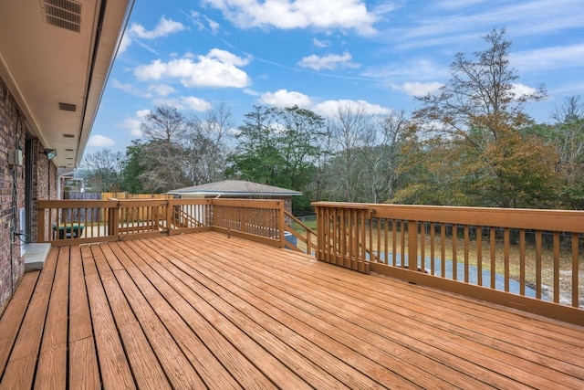 wooden deck with a water view