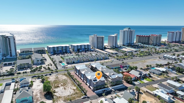 bird's eye view featuring a view of the beach and a water view