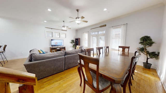 dining space featuring ornamental molding, light hardwood / wood-style flooring, and ceiling fan