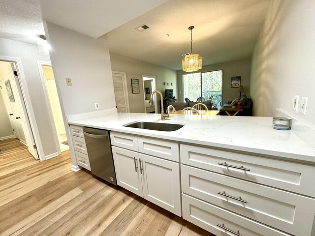 200 Sandestin Ln Unit 1307, Miramar Beach, FL 32550 - kitchen with a sink, dishwasher, light wood-type flooring, and a peninsula