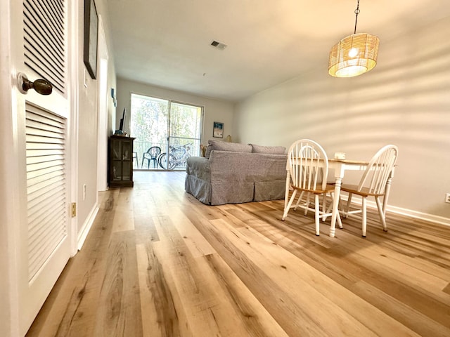 dining space featuring light hardwood / wood-style floors