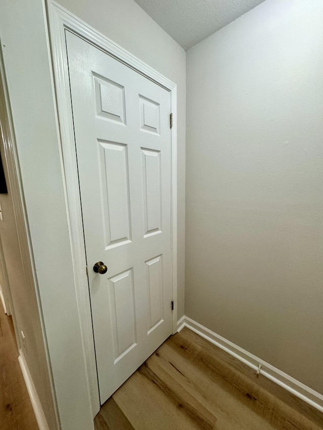 details featuring hardwood / wood-style floors and a textured ceiling