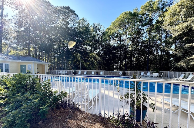 view of swimming pool featuring a patio area